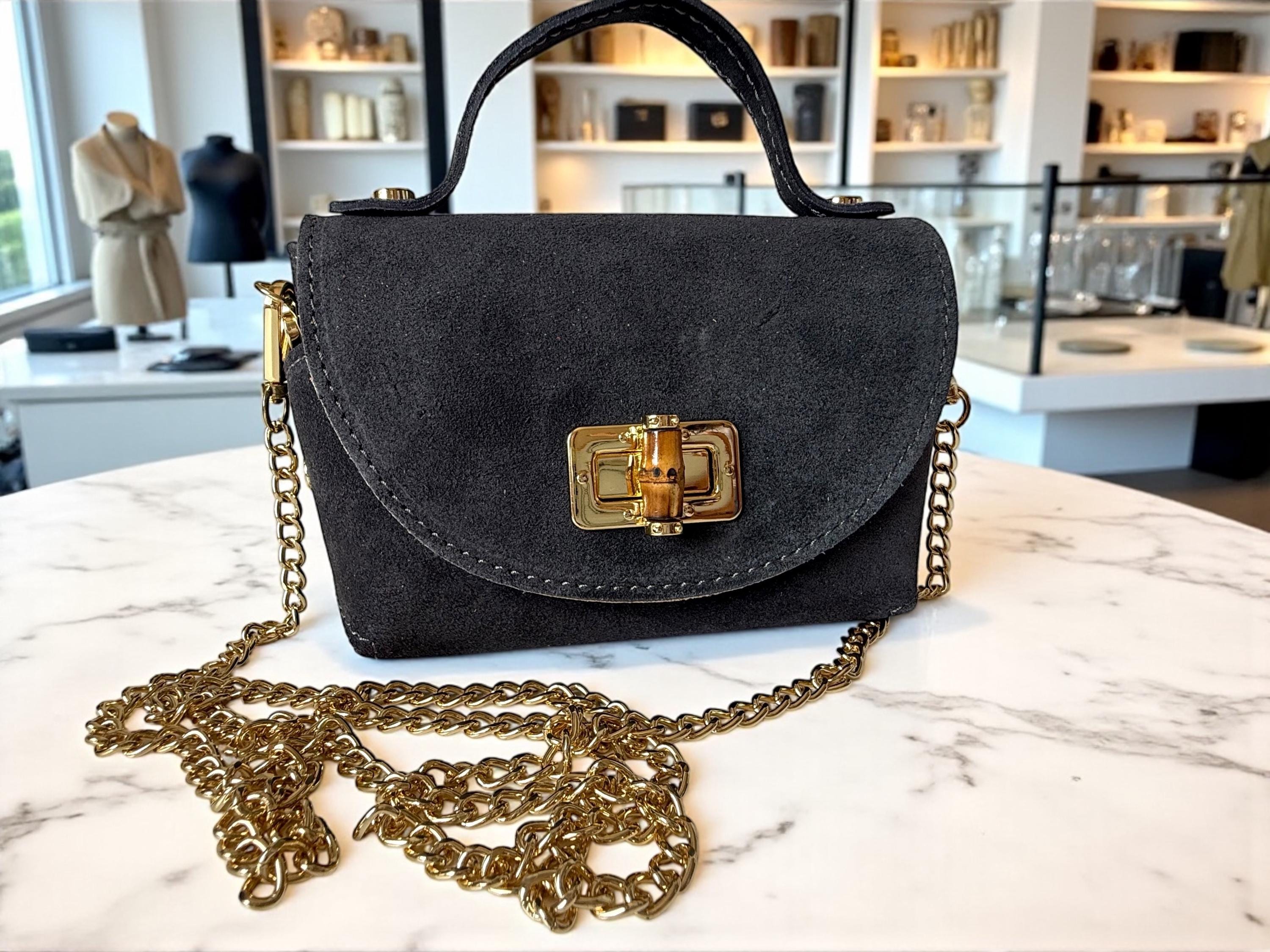 Mini bolso de ante o piel en tonos tierra