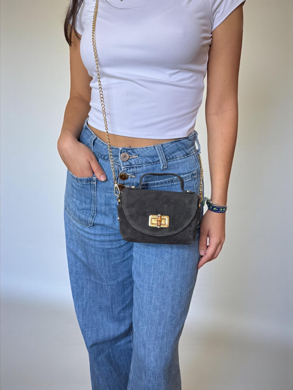 Mini bolso de ante o piel en tonos tierra