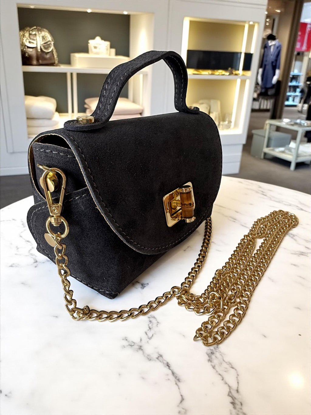 Mini bolso de ante o piel en tonos tierra