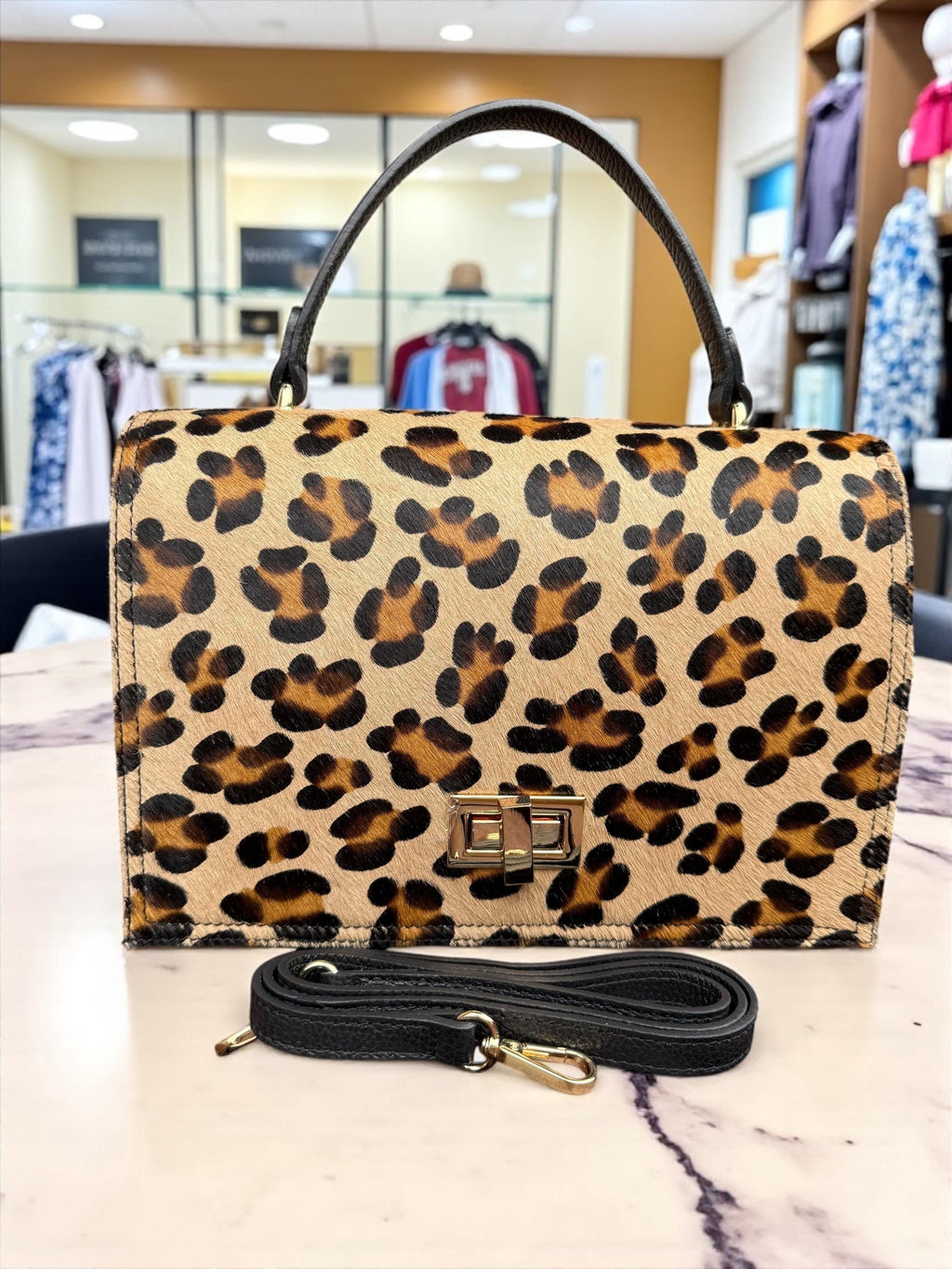 Bolso tipo cartera en pelo de poni con estampado de leopardo y cuero granulado auténtico