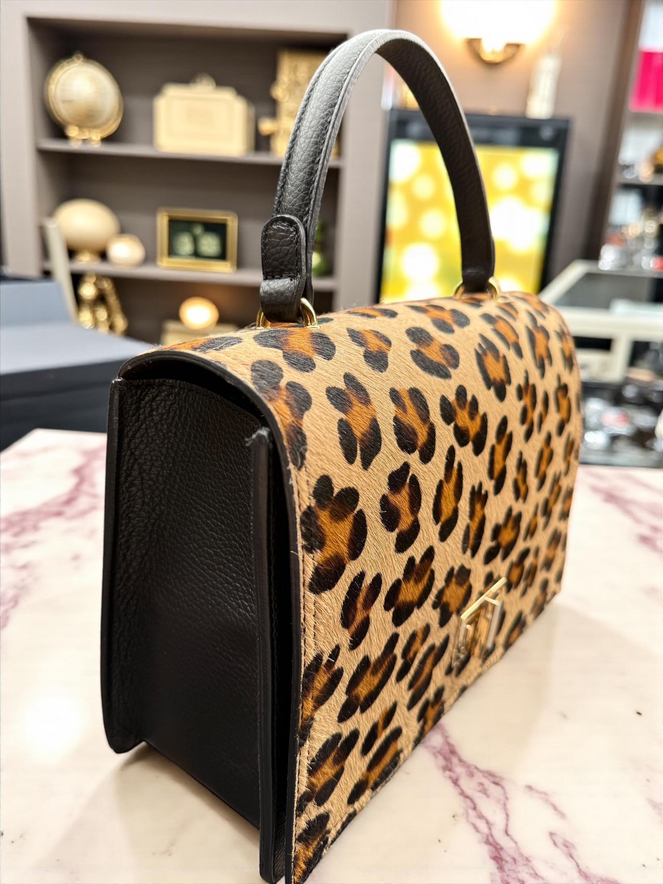 Bolso tipo cartera en pelo de poni con estampado de leopardo y cuero granulado auténtico