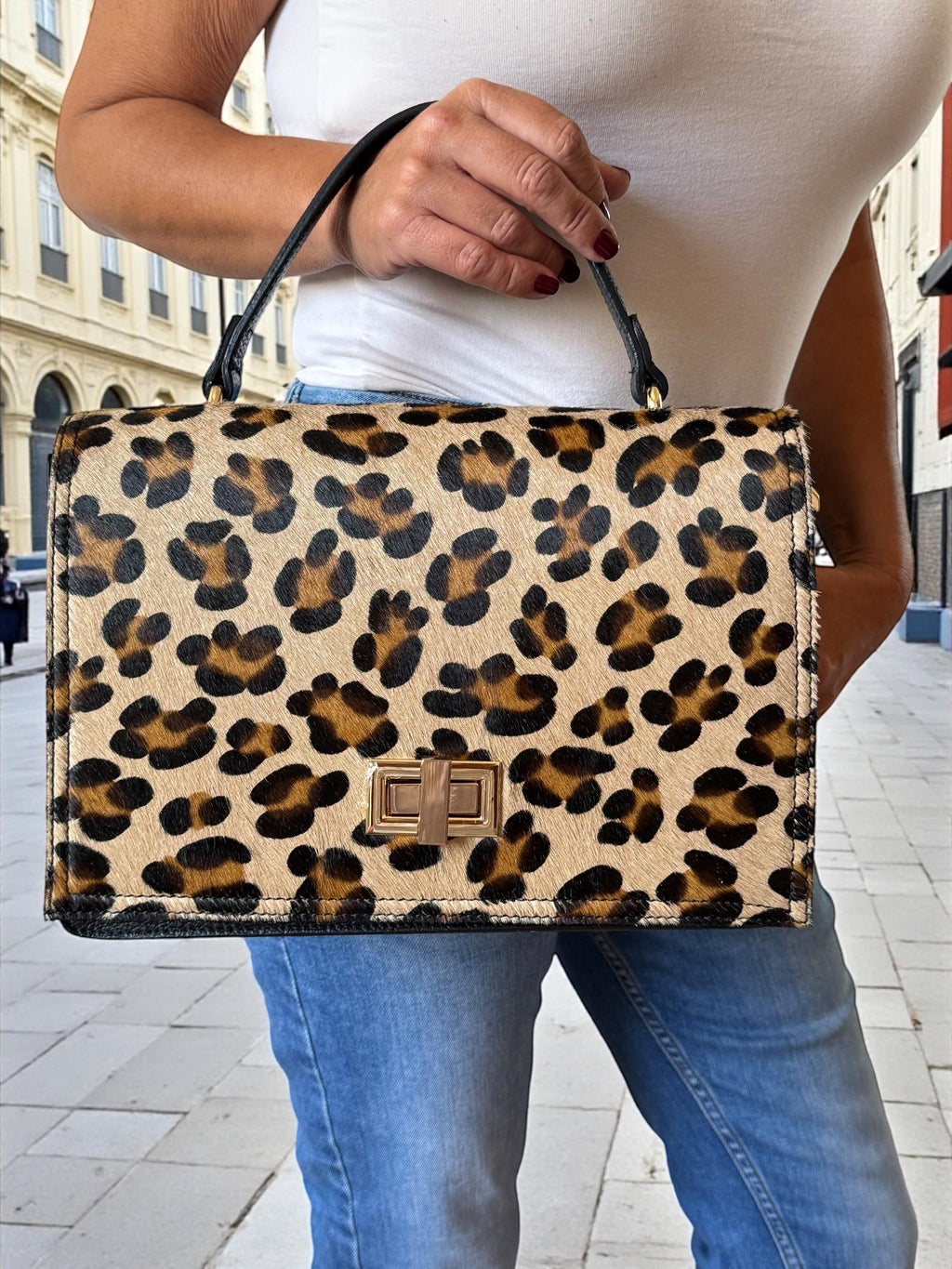 Bolso tipo cartera en pelo de poni con estampado de leopardo y cuero granulado auténtico