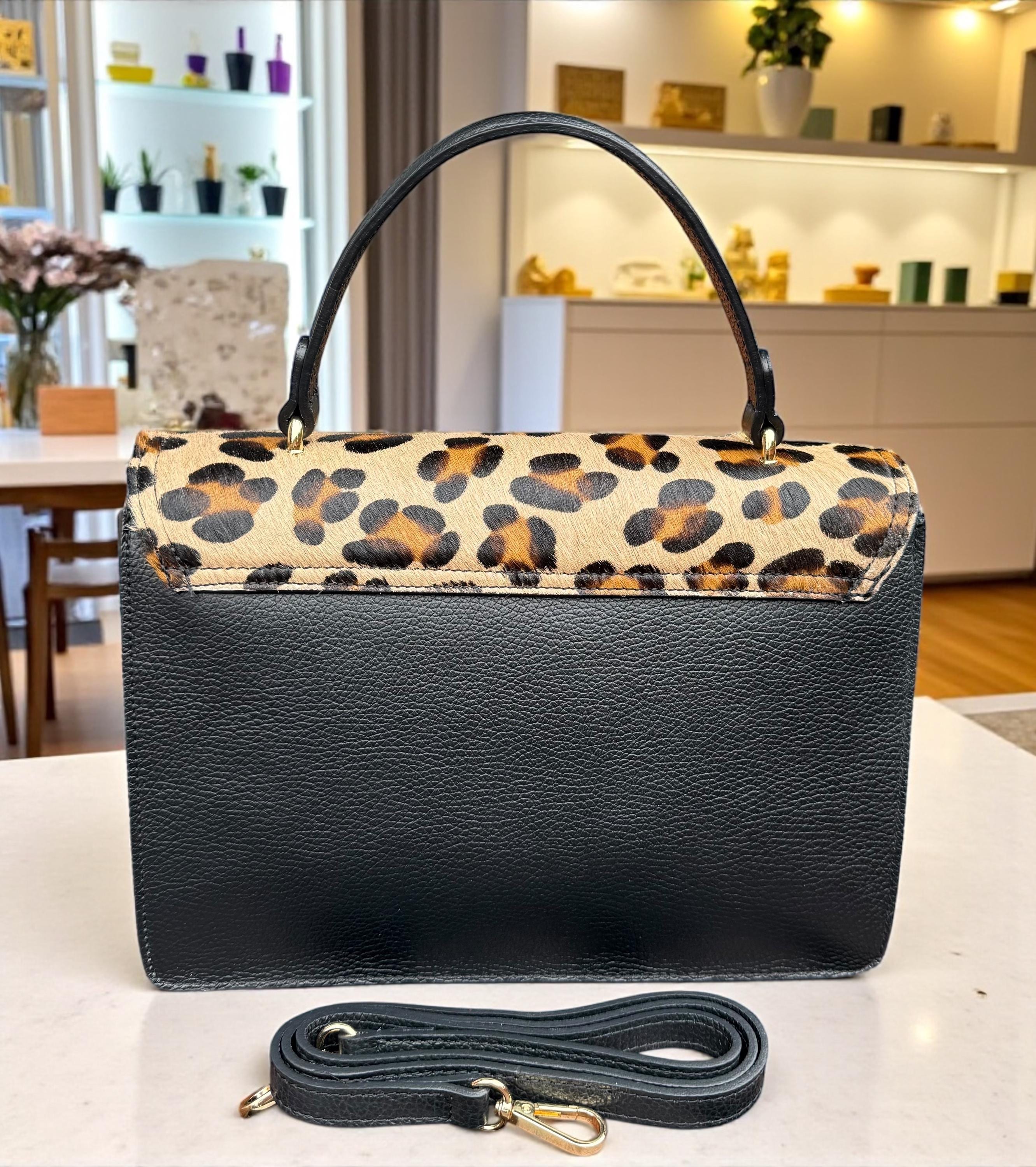 Bolso tipo cartera en pelo de poni con estampado de leopardo y cuero granulado auténtico
