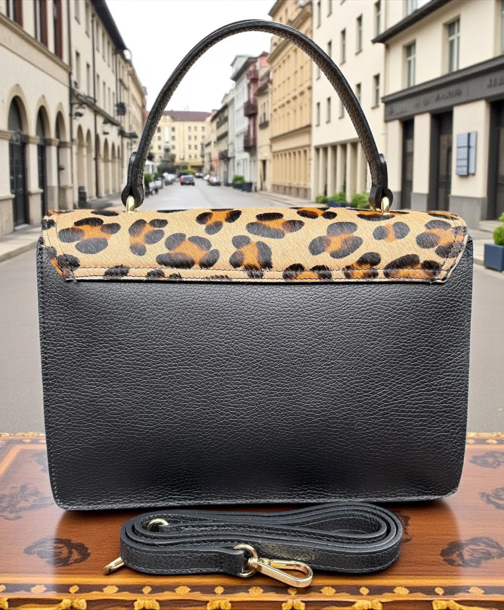 Bolso tipo cartera en pelo de poni con estampado de leopardo y cuero granulado auténtico