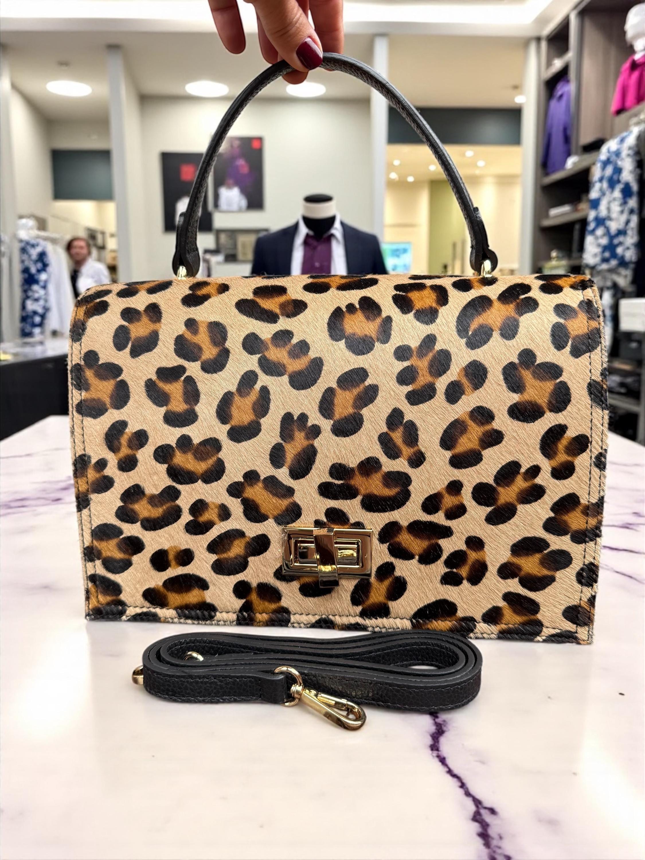 Bolso tipo cartera en pelo de poni con estampado de leopardo y cuero granulado auténtico