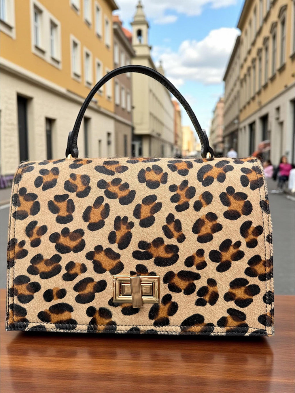 Bolso tipo cartera en pelo de poni con estampado de leopardo y cuero granulado auténtico