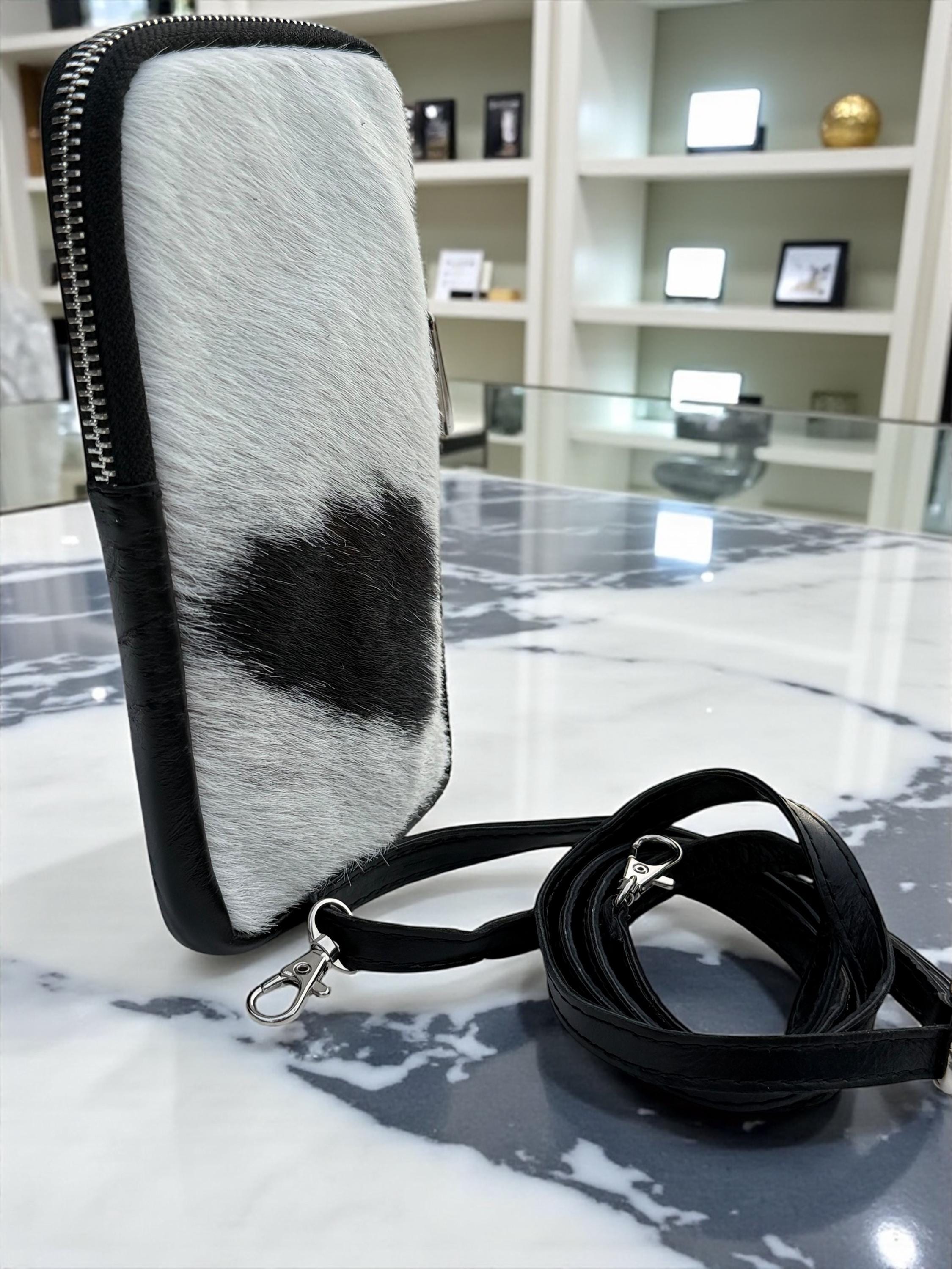 Bolsa para teléfono de piel auténtica con estampado de vaca