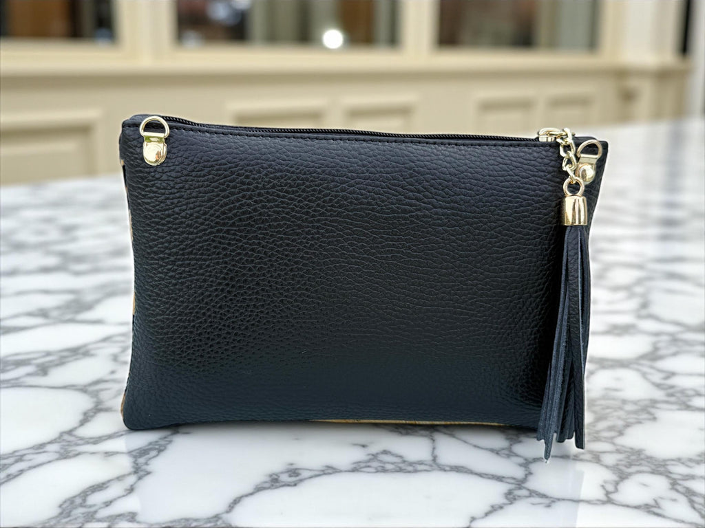 Bolso de mano de piel sintética con estampado de leopardo y pelo de poni, con borla